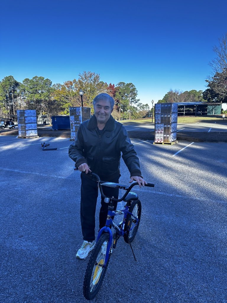 Rick Mantei Supports Toys for Tots with Bike Donation and Hands-On Help